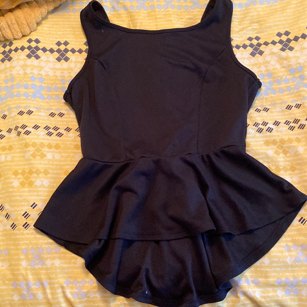 Black sleeveless professional blouse. Open back with bow on back.